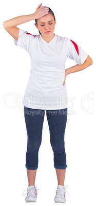 Disappointed football fan in white jersey