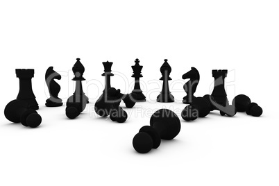 Black chess pieces fallen and standing