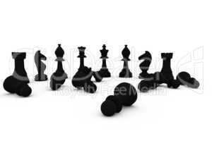Black chess pieces fallen and standing