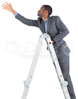 Businessman climbing up ladder