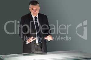 Concentrating businessman looking at desk