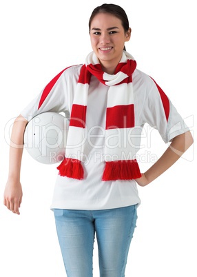 Football fan in white wearing scarf holding ball