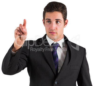 Young businessman standing and pointing
