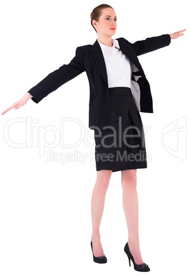 Businesswoman performing a balancing act