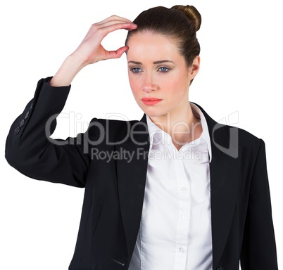 Businesswoman thinking and touching head