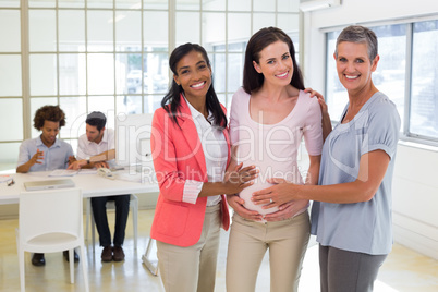 Attractive pregnant businesswoman at work