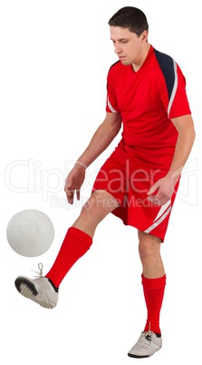 Fit young football player kicking