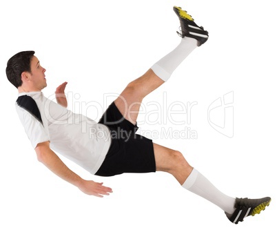 Football player in white kicking