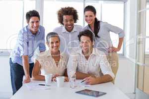 Attractive business people smiling in the workplace