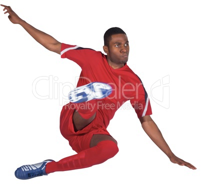 Football player in red kicking