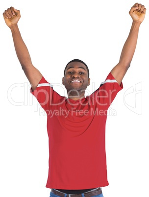 Excited handsome football fan cheering