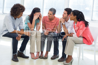 Group therapy in session sitting in a circle