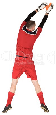 Fit goal keeper jumping up Fit goal keeper jumping up