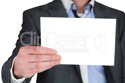 Businessman in grey suit showing card