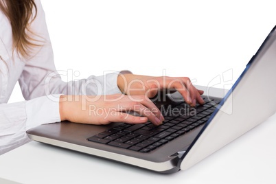 Woman typing on her laptop