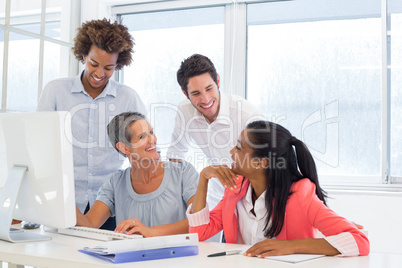 Casual workers smiling and discussing