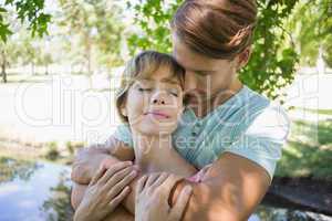 Affectionate young couple standing together in the park
