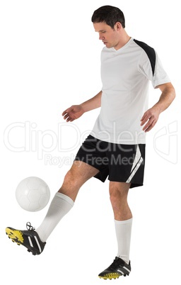 Football player in white kicking