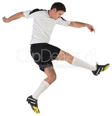 Football player in white kicking