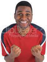 Excited handsome football fan cheering