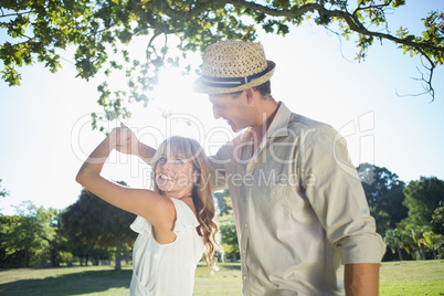 Cute couple dancing in the park