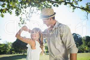 Cute couple dancing in the park