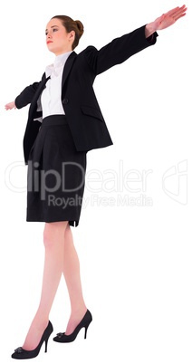 Businesswoman performing a balancing act