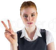 Redhead businesswoman showing peace sign