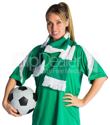 Pretty football fan in green jersey