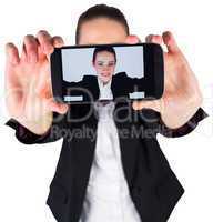 Businesswoman taking a selfie on smartphone