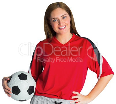 Pretty football fan smiling at camera