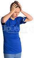 Disappointed football fan in blue jersey