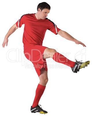 Football player in red kicking