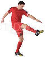 Football player in red kicking