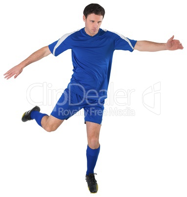 Football player in blue kicking