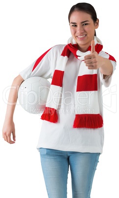 Football fan in white wearing scarf holding ball