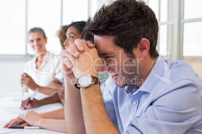 Business people laughing during a meeting