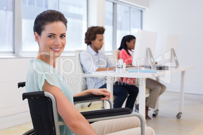 Woman in wheelchair working hard