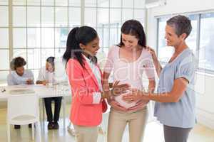 Attractive pregnant businesswoman at work