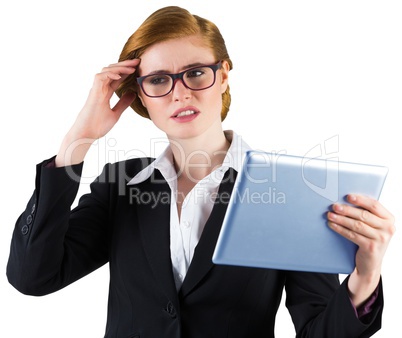 Redhead businesswoman using her tablet pc Redhead businesswoman using her tablet pc