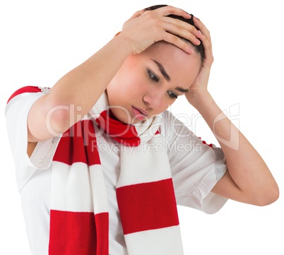 Disappointed football fan looking down Disappointed football fan looking down