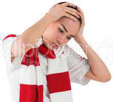 Disappointed football fan looking down