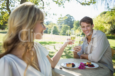 Cute blonde toasting with her smiling boyfriend