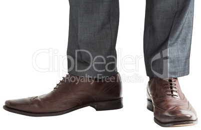 Businessmans feet in brown brogues