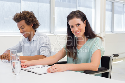 Attractive businesswoman smiling in the workplace