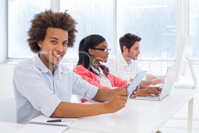 Three business people hard at work