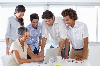 Workers using laptop to do work