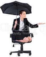 Businesswoman holding a black umbrella