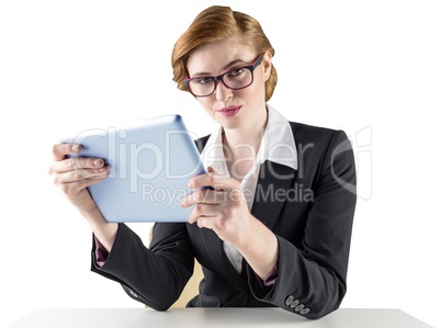 Redhead businesswoman using her tablet pc