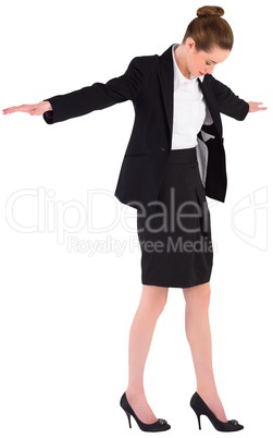 Businesswoman performing a balancing act